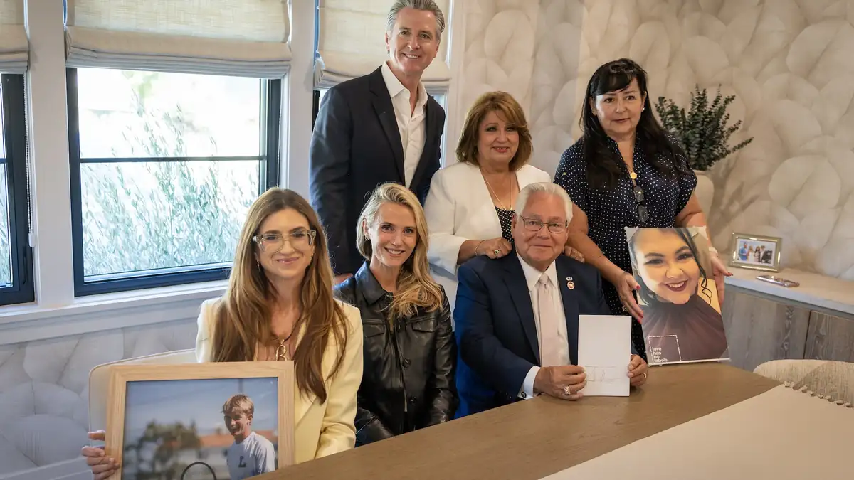 California Governor Gavin Newsom with officials and family members during Braun’s Law signing event
