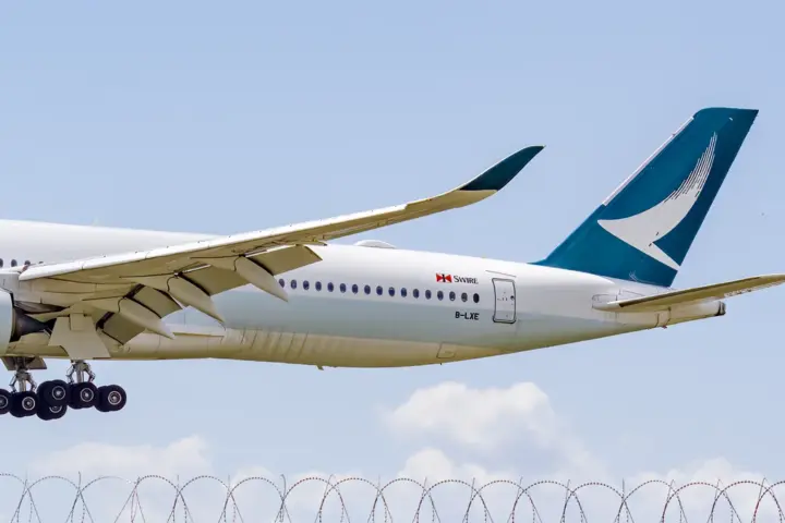 Cathay Pacific wide-body Airbus A350 passenger airliner taxiing on an airport runway