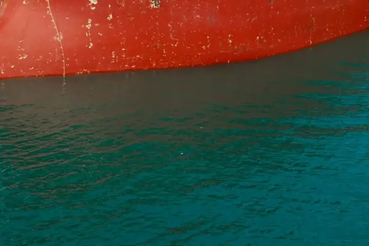 Large commercial crude oil carrier docked at an offshore loading platform in northern Persian Gulf waters
