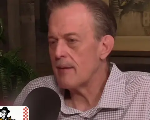 Billy Gardell speaking into a microphone during the Breaking Bread with Tom Papa podcast
