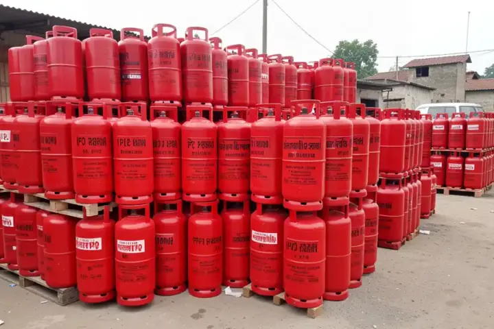 Red liquefied petroleum gas cylinders stacked at a commercial distribution point in India.