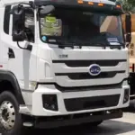 White BYD heavy electric truck displayed outdoors