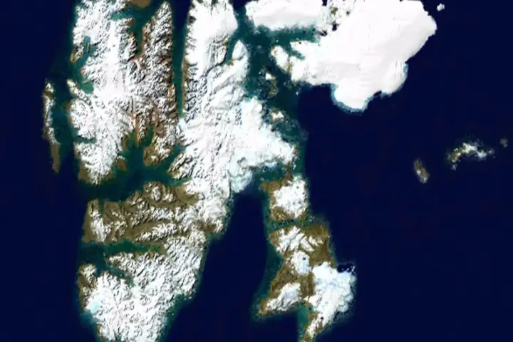 Landsat satellite image of Svalbard Arctic showing ice and fjord landscape