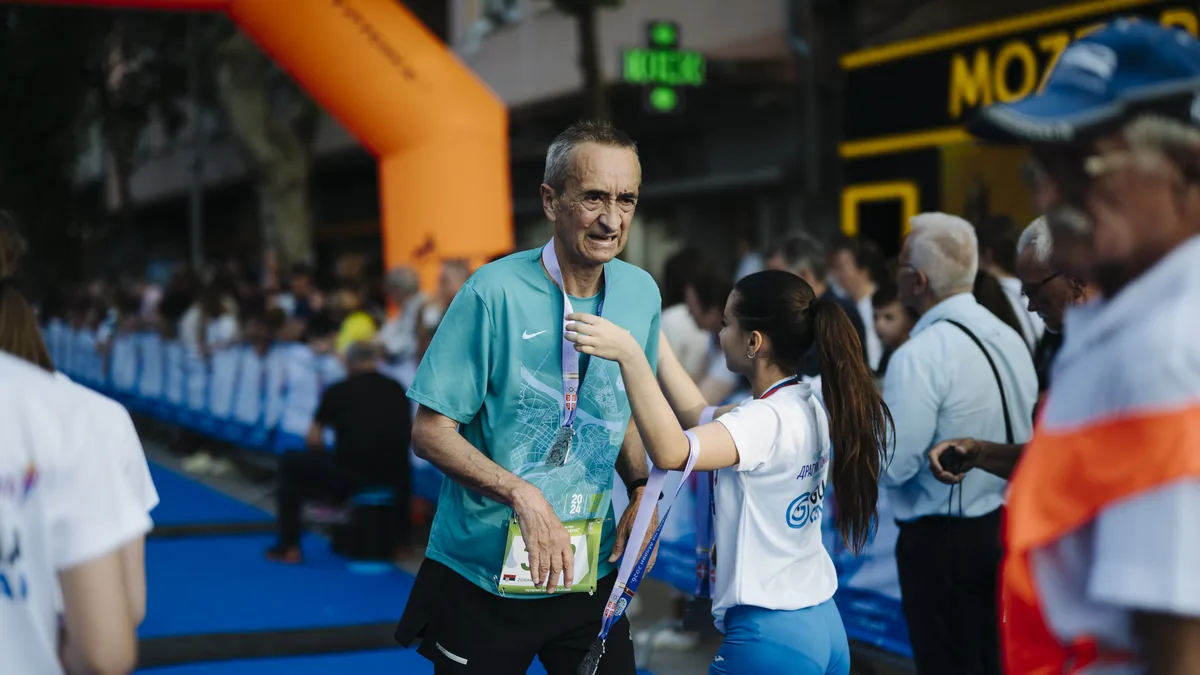 Runner finishes a race at a local running event, contextual image for the Sydney Marathon energy gel litter article