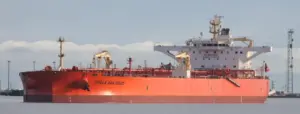 Large crude oil tanker berthed alongside a marine export terminal.