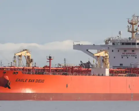 Large crude oil tanker berthed alongside a marine export terminal.