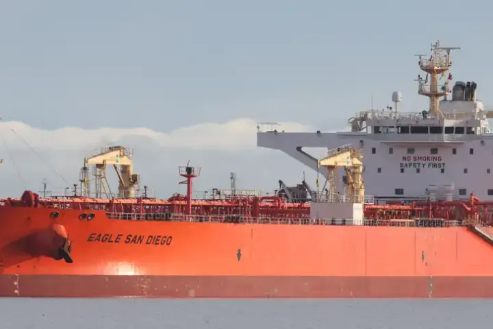 Large crude oil tanker berthed alongside a marine export terminal.
