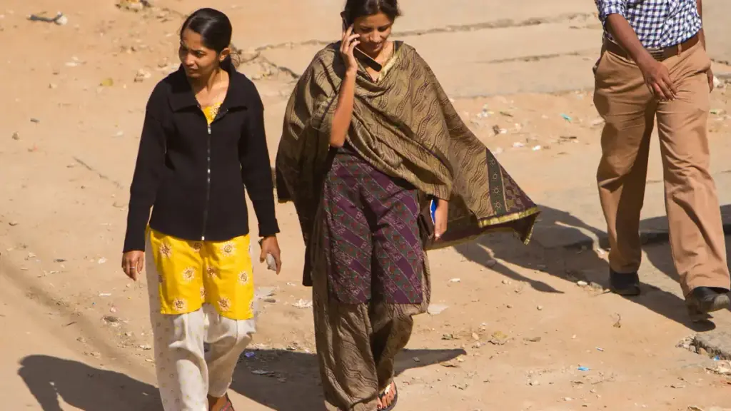 Woman using a mobile phone in Bengaluru, India.