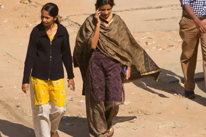 Woman using a mobile phone in Bengaluru, India.