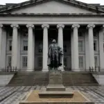U.S. Treasury Building and Albert Gallatin statue in Washington, D.C., photographed from street level.