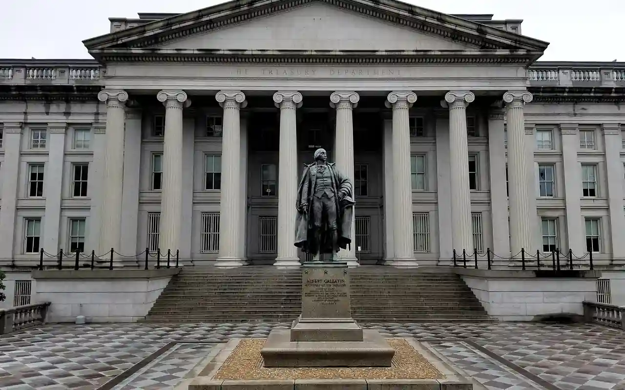 U.S. Treasury Building and Albert Gallatin statue in Washington, D.C., photographed from street level.