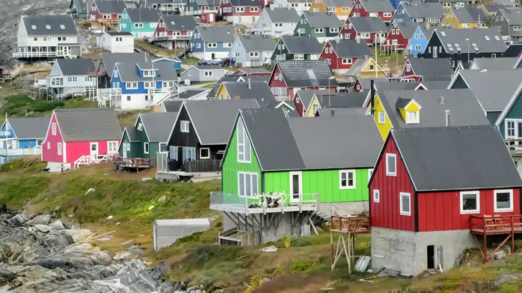 Multicolored coastal houses clustered along the waterfront in Nuuk, Greenland.