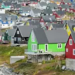 Multicolored coastal houses clustered along the waterfront in Nuuk, Greenland.