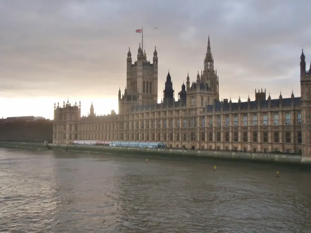 Panoramic exterior view of the Palace of Westminster and Parliament building along the River Thames