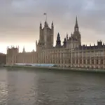 Panoramic exterior view of the Palace of Westminster and Parliament building along the River Thames