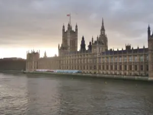 Panoramic exterior view of the Palace of Westminster and Parliament building along the River Thames
