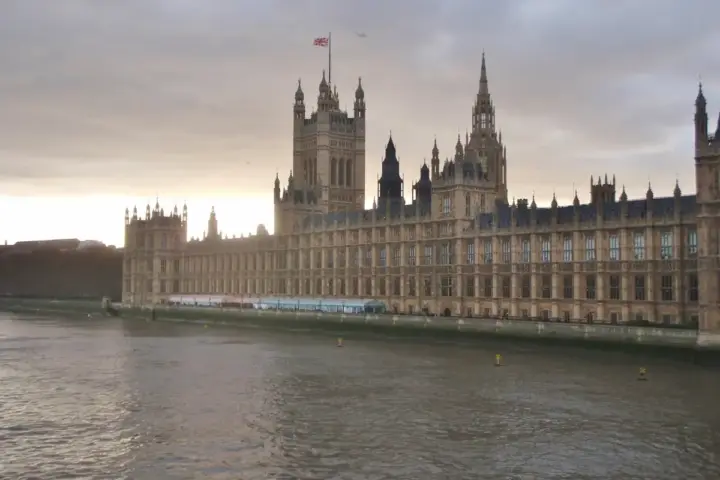 Panoramic exterior view of the Palace of Westminster and Parliament building along the River Thames