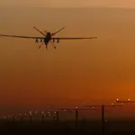 Reaper remotely piloted aircraft landing on a military runway during defence operations