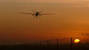 Reaper remotely piloted aircraft landing on a military runway during defence operations