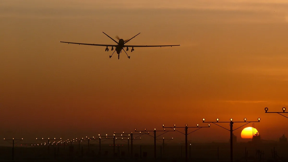Reaper remotely piloted aircraft landing on a military runway during defence operations