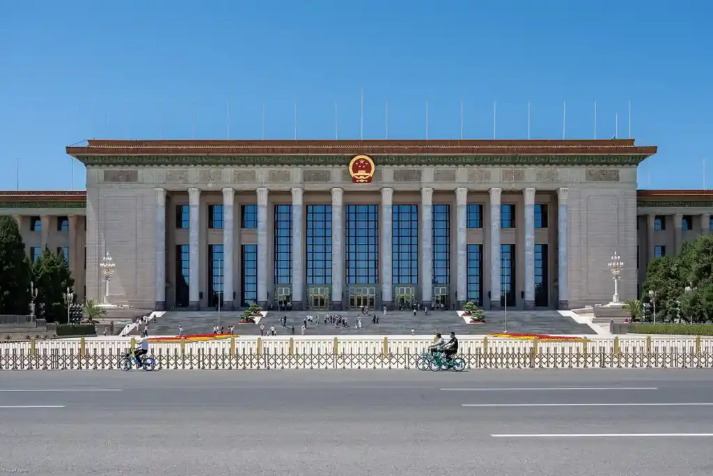 Wide exterior photograph of the Great Hall of the People building in Beijing under an open sky
