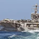 USS Abraham Lincoln aircraft carrier maneuvering at sea