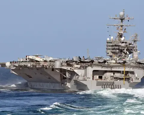 USS Abraham Lincoln aircraft carrier maneuvering at sea