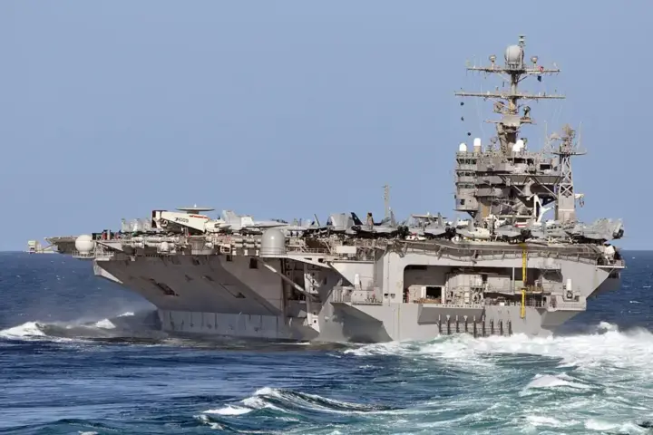 USS Abraham Lincoln aircraft carrier maneuvering at sea