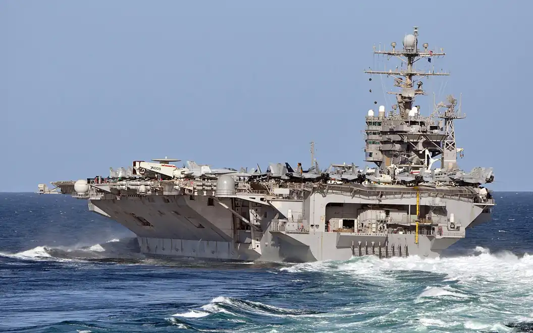 USS Abraham Lincoln aircraft carrier maneuvering at sea