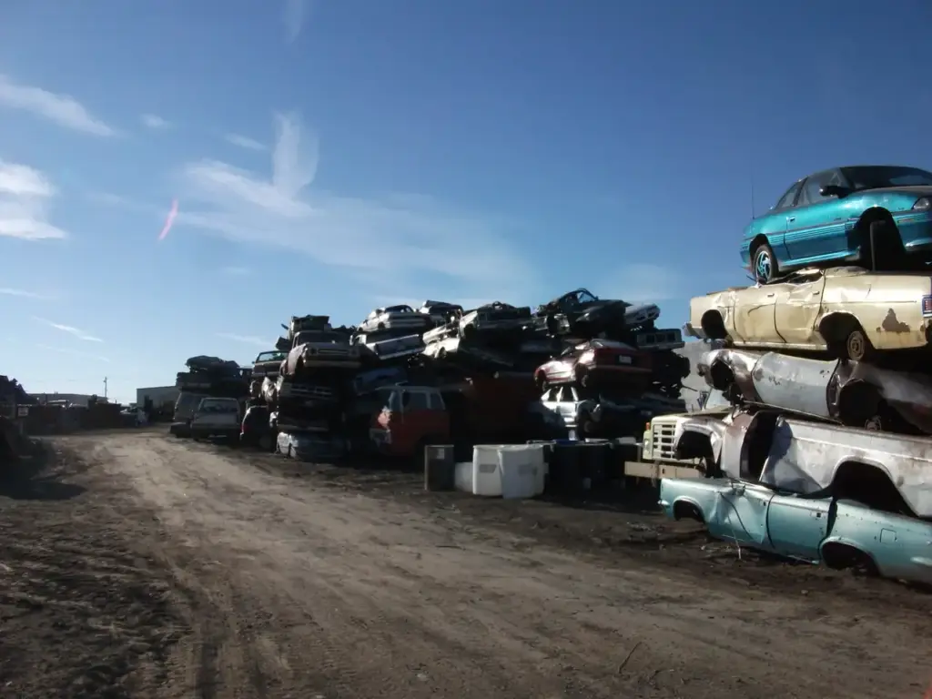 Cars awaiting shredding in a recycling yard, representing the vehicle recycling infrastructure behind India's EPR circular economy shift.