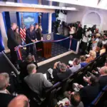 Rows of empty theater seating and media facilities inside the James S. Brady Press Briefing Room.