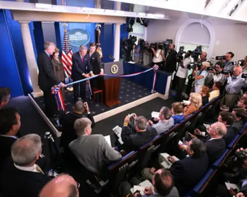 Rows of empty theater seating and media facilities inside the James S. Brady Press Briefing Room.