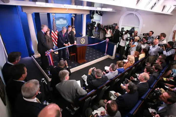 Rows of empty theater seating and media facilities inside the James S. Brady Press Briefing Room.