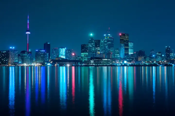 Toronto skyline at night representing the city hosting Nuit Blanche all-night public art event