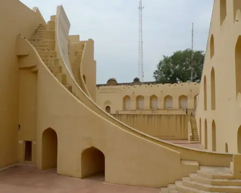 Stone astronomical structures and landscaped grounds at Jantar Mantar in New Delhi.