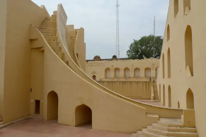 Stone astronomical structures and landscaped grounds at Jantar Mantar in New Delhi.