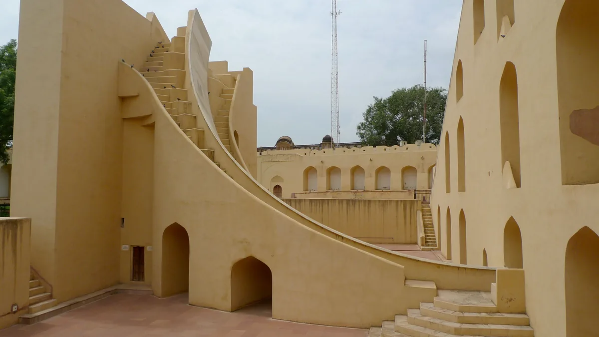 Stone astronomical structures and landscaped grounds at Jantar Mantar in New Delhi.