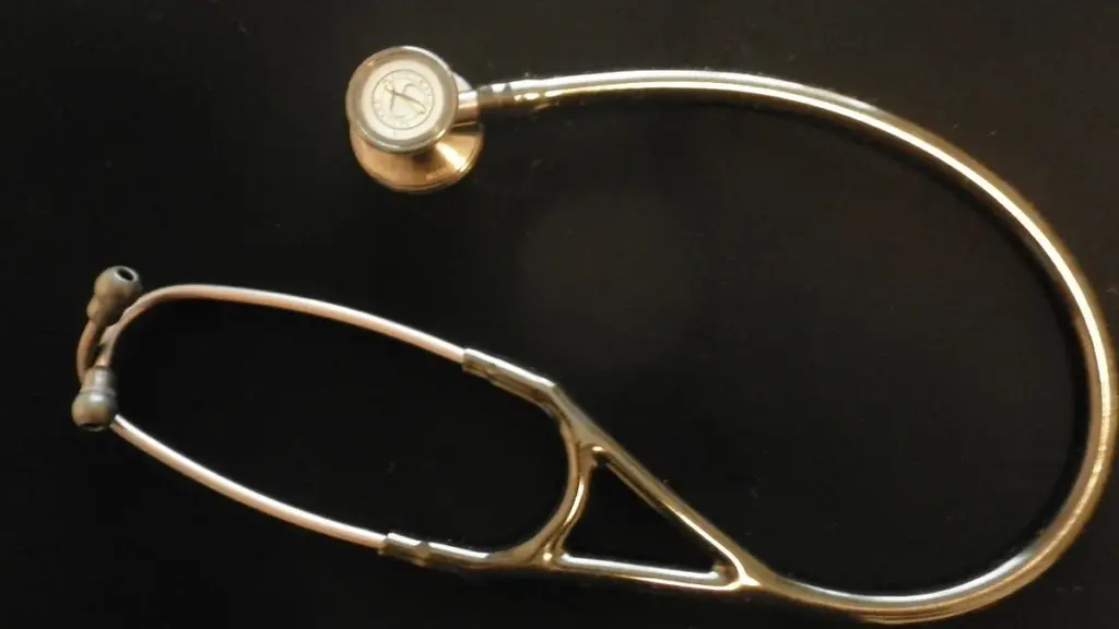 A stethoscope resting on a flat surface, representing employer-sponsored health insurance premiums and out-of-pocket costs