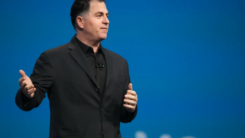 Photograph of Dell Technologies founder Michael Dell addressing attendees from a podium during an executive corporate conference.