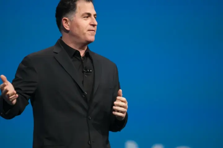Photograph of Dell Technologies founder Michael Dell addressing attendees from a podium during an executive corporate conference.