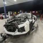 Damaged Corvette C8 on trailer after test-drive crash