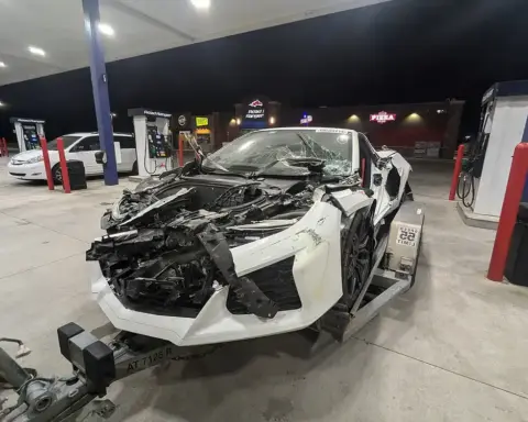 Damaged Corvette C8 on trailer after test-drive crash