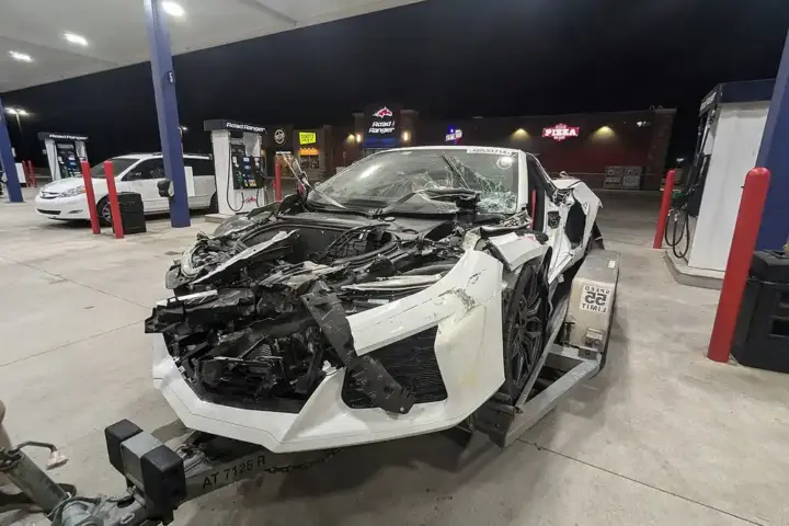 Damaged Corvette C8 on trailer after test-drive crash