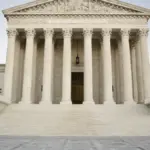 Front facade of the United States Supreme Court building in Washington, D.C., displaying marble pillars and the inscription Equal Justice Under Law.