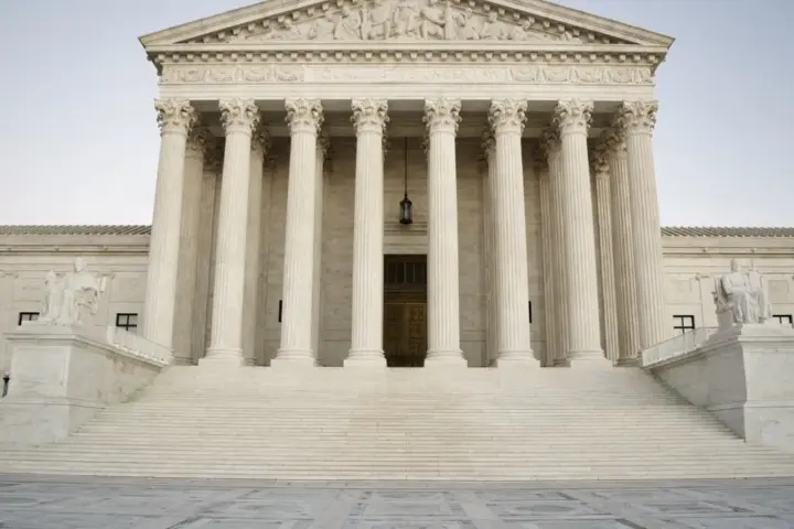 Front facade of the United States Supreme Court building in Washington, D.C., displaying marble pillars and the inscription Equal Justice Under Law.