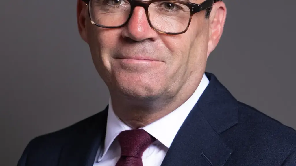 Official portrait photograph of British Prime Minister Andy Burnham in formal parliamentary attire.