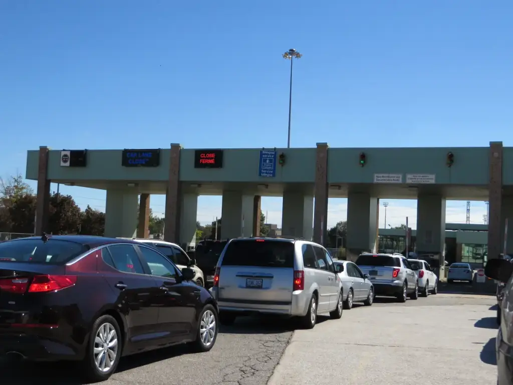The Ambassador Bridge suspension bridge connecting Detroit Michigan and Windsor Ontario, representing the Canada-US international border and trade relationship