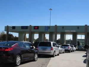 The Ambassador Bridge suspension bridge connecting Detroit Michigan and Windsor Ontario, representing the Canada-US international border and trade relationship