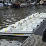 Boats on an Amsterdam canal, illustrating the city waterway context