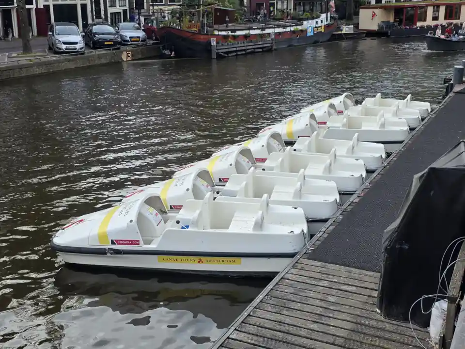 Boats on an Amsterdam canal, illustrating the city waterway context